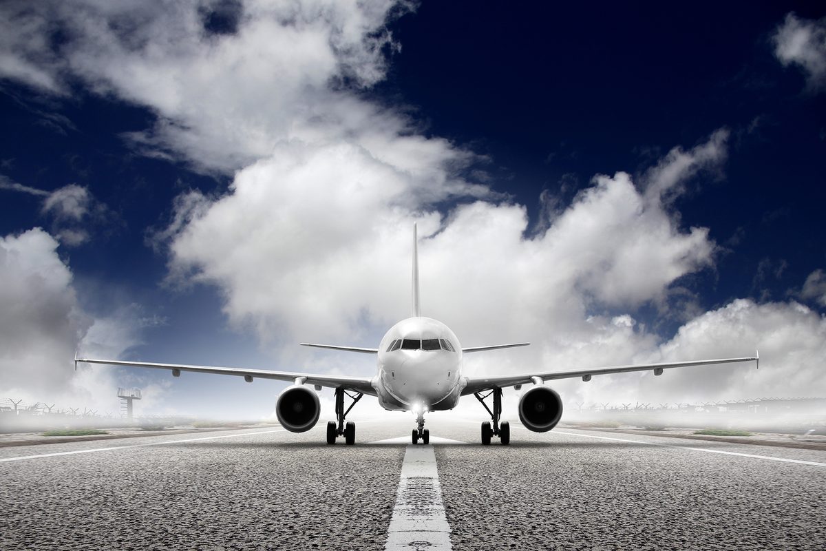 Commercial aircraft on runway — where FOD Control Corporation started, protecting runways from foreign object debris